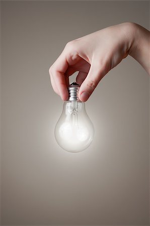 simsearch:400-04265413,k - Hand holding a glowing light bulb Stock Photo - Budget Royalty-Free & Subscription, Code: 400-06740928