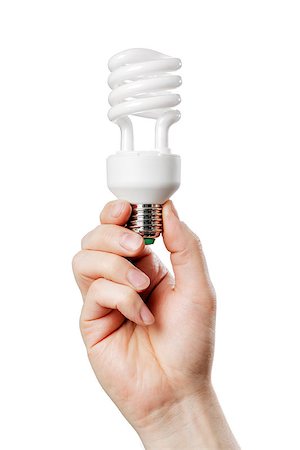 Man holding Compact Fluorescent Lamp Bulb in his hand. Stock Photo - Budget Royalty-Free & Subscription, Code: 400-06741262