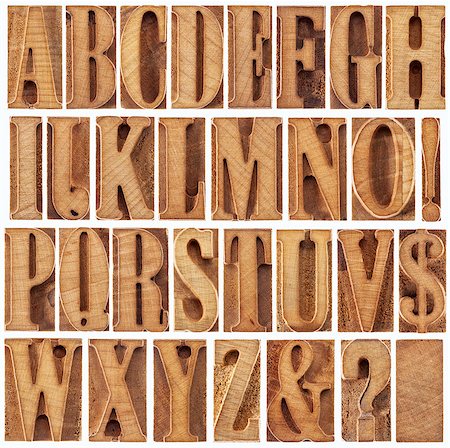 alphabet in modern letterpress wood type printing blocks (unused), a collage of 26 isolated letters, question mark, exclamation point, ampersand and dollar sign Stock Photo - Budget Royalty-Free & Subscription, Code: 400-06743004