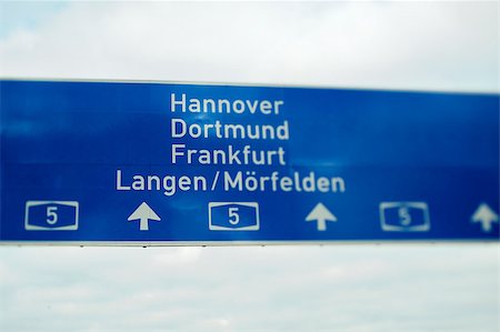 German highway sign - direction sign to Hannover, Dortmund, Frankfurt and Langen/Morfelden. Useful file for your flyer about European and German road infrastructure and other need. Tilt-shift lens used to accent the sign and acieve more cinematic effect. Stock Photo - Budget Royalty-Free & Subscription, Code: 400-06743705