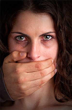 petrified (terrified) - Closeup of a mans hand covering a womans mouth. Concept of domestic violence or kidnapping. Dark mood. Stock Photo - Budget Royalty-Free & Subscription, Code: 400-06743853