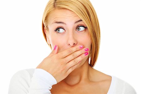 simsearch:400-04175955,k - A picture of a young scared woman covering her lips with hands over white background Stock Photo - Budget Royalty-Free & Subscription, Code: 400-06758402