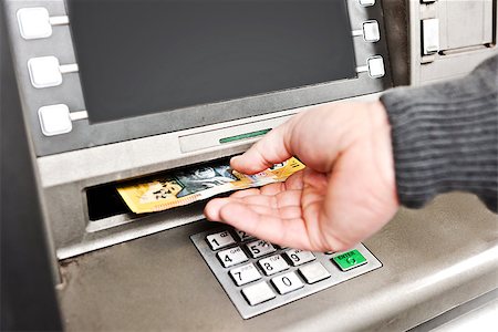 simsearch:400-05670021,k - a man uses an ATM to withdraw money, in Australia, $50 notes Stock Photo - Budget Royalty-Free & Subscription, Code: 400-06759191