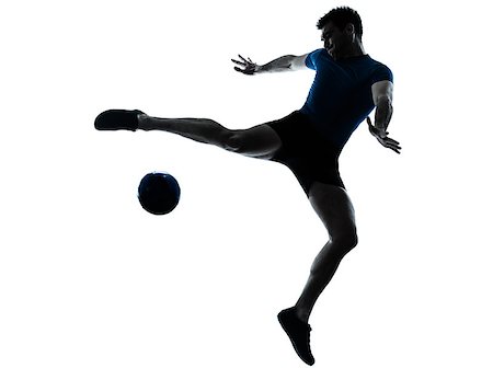 one caucasian man flying kicking playing soccer football player silhouette  in studio isolated on white background Stock Photo - Budget Royalty-Free & Subscription, Code: 400-06750141