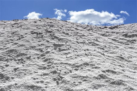 Big pile of freshly mined salt, set against a blue sky Stock Photo - Budget Royalty-Free & Subscription, Code: 400-06751095