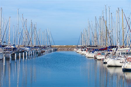 simsearch:400-04793526,k - Rows of small luxury pleasure yachts moored in a marina under a sunny blue sky Stock Photo - Budget Royalty-Free & Subscription, Code: 400-06751993