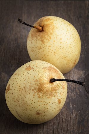 simsearch:400-07096505,k - two asian ripe yellow pears on old wooden table, selective focus Stock Photo - Budget Royalty-Free & Subscription, Code: 400-06764199