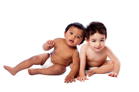 Two cute adorable multi-ethnic babies sitting together, childhood concept, on white. Stock Photo - Budget Royalty-Free & Subscription, Code: 400-06764476