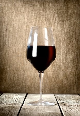 Red wine glass on the wooden table Stock Photo - Budget Royalty-Free & Subscription, Code: 400-06766074