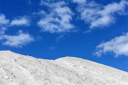 Big pile of freshly mined salt, set against a blue sky Stock Photo - Budget Royalty-Free & Subscription, Code: 400-06766966