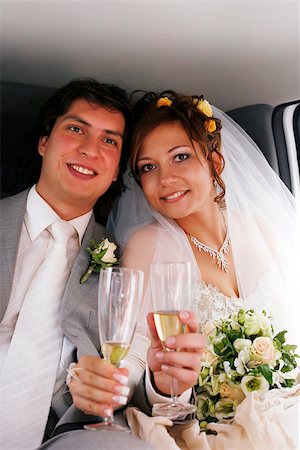 simsearch:400-04978489,k - The bride with the groom drinks champagne in the automobile Stock Photo - Budget Royalty-Free & Subscription, Code: 400-06768145