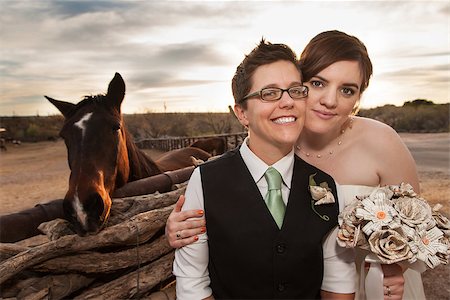 Boyish groom and lesbian bride outdoors near horse Photographie de stock - Aubaine LD & Abonnement, Code: 400-06768966