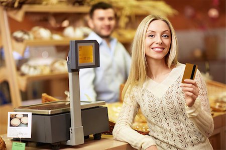 Young girl with a credit card at the store Stock Photo - Budget Royalty-Free & Subscription, Code: 400-06769228