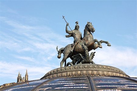 Sculpture crowns the dome of the fountain "Watch the World" at the Manege Square in Moscow Stock Photo - Budget Royalty-Free & Subscription, Code: 400-06760240