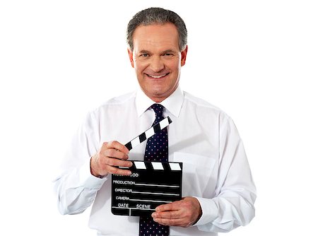 Aged corporate male holding clapperboard. Shot on white background Stock Photo - Budget Royalty-Free & Subscription, Code: 400-06761066