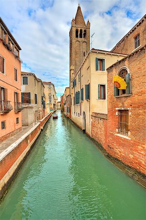simsearch:400-08093706,k - Vertical oriented image of narrow canal among old typical houses and belfry tower on background in Venice, Italy. Stock Photo - Budget Royalty-Free & Subscription, Code: 400-06761340