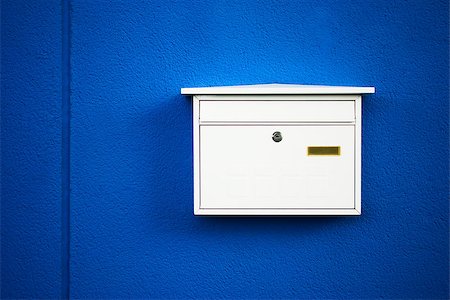 Postbox white on a blue wall ,outdoor Stock Photo - Budget Royalty-Free & Subscription, Code: 400-06761417