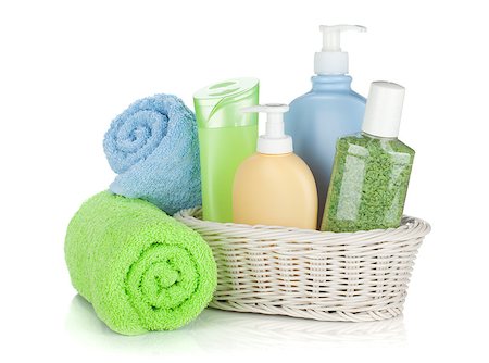 Cosmetics bottles and towels. Isolated on white background Photographie de stock - Aubaine LD & Abonnement, Code: 400-06761591