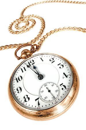 pocket watch - Antique golden pocket watch with chain, showing a few minutes to midnight isolated on white background. Concept of time,the past or deadline. Stock Photo - Budget Royalty-Free & Subscription, Code: 400-06762960