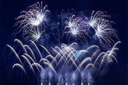 simsearch:400-06745167,k - Colorful fireworks over dark sky, displayed during a celebration Stock Photo - Budget Royalty-Free & Subscription, Code: 400-06770184
