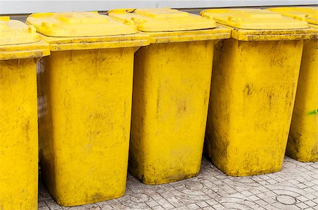 simsearch:400-04917651,k - Dirty bin in a group made of yellow plastic Stock Photo - Budget Royalty-Free & Subscription, Code: 400-06788284