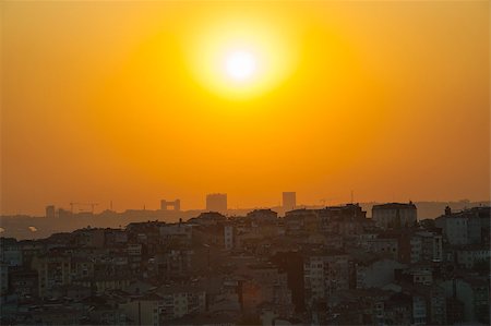 Orange sunset over a cityscape showing silhouette skyline of Istanbul Turkey Stock Photo - Budget Royalty-Free & Subscription, Code: 400-06789676