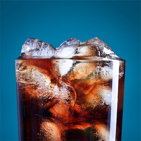 glass of cola with ice on blue background Stock Photo - Budget Royalty-Free & Subscription, Code: 400-06794299