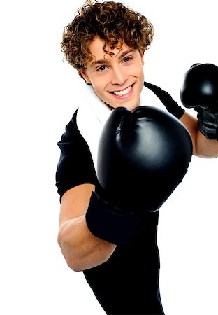 simsearch:400-06482604,k - Young man with black boxing gloves and aggressive action Stock Photo - Budget Royalty-Free & Subscription, Code: 400-06795498