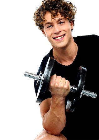 simsearch:400-06482604,k - Smiling athlete doing exercise with dumbbell Stock Photo - Budget Royalty-Free & Subscription, Code: 400-06795504