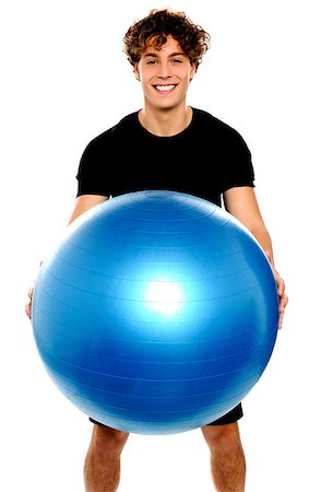 simsearch:400-06482604,k - Man in sportswear holding big ball isolated against white background Stock Photo - Budget Royalty-Free & Subscription, Code: 400-06795509
