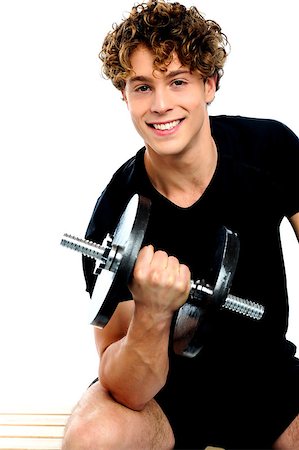 simsearch:400-06482604,k - Fit trainer doing biceps exercise against white background Stock Photo - Budget Royalty-Free & Subscription, Code: 400-06795503