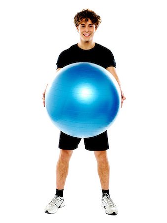 simsearch:400-06482604,k - Male fitness trainer holding a pilate ball isolated on a over white background Stock Photo - Budget Royalty-Free & Subscription, Code: 400-06795510