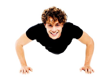 simsearch:400-06482604,k - Healthy young guy doing push-ups exercise against white background Stock Photo - Budget Royalty-Free & Subscription, Code: 400-06795513