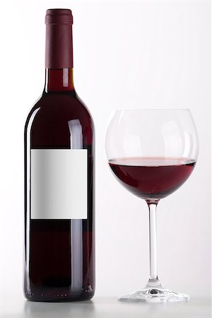 simsearch:640-02770391,k - Bottle and glass of red wine isolated on white background Stock Photo - Budget Royalty-Free & Subscription, Code: 400-06796093