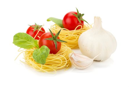 simsearch:400-06796273,k - Cherry tomatoes, basil, garlic and pasta. Isolated on white background Stock Photo - Budget Royalty-Free & Subscription, Code: 400-06796257