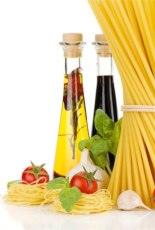 simsearch:400-06796273,k - Pasta, tomatoes, basil, olive oil, vinegar, garlic and parmesan cheese. Isolated on white background Stock Photo - Budget Royalty-Free & Subscription, Code: 400-06796259