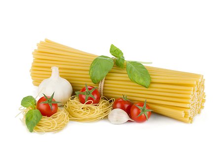 simsearch:400-06796273,k - Italian pasta, tomatoes, basil and garlic. Isolated on white background Stock Photo - Budget Royalty-Free & Subscription, Code: 400-06796261