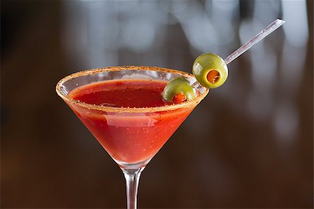 pimento - closeup of a bloody mary cocktail garnished with olives isolated on a busy bar top Stock Photo - Budget Royalty-Free & Subscription, Code: 400-06797124
