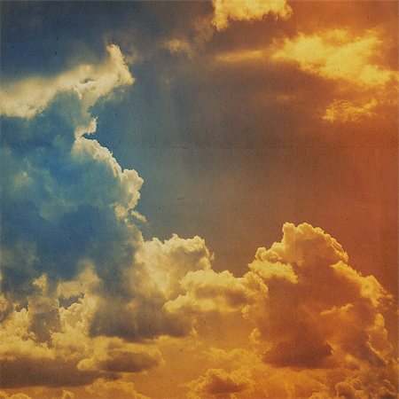 clouds on a textured vintage paper background, with grunge stains Foto de stock - Super Valor sin royalties y Suscripción, Código: 400-06798348