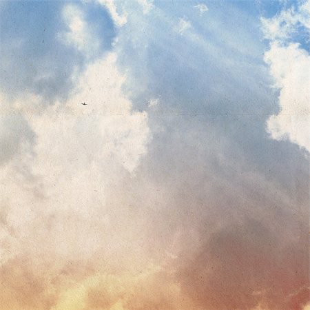 clouds on a textured vintage paper background, with grunge stains Foto de stock - Super Valor sin royalties y Suscripción, Código: 400-06798343