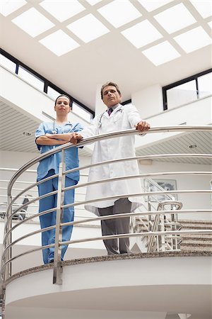 Nurse and doctor standing at the stairwell in hospital corridor Stock Photo - Budget Royalty-Free & Subscription, Code: 400-06799599