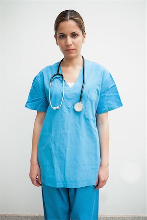 Nurse is standing in the corridor looking at the camera Stock Photo - Budget Royalty-Free & Subscription, Code: 400-06799718