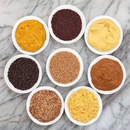 Mustard selection of powder, seed, french, dijon, english and wholegrain in white porcelain spoons over marble background. Photographie de stock - Aubaine LD & Abonnement, Code: 400-06790443