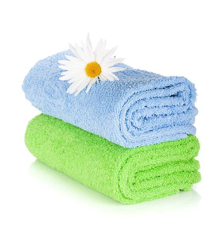 Blue and green towels and camomile flower. Isolated on white background Photographie de stock - Aubaine LD & Abonnement, Code: 400-06790581