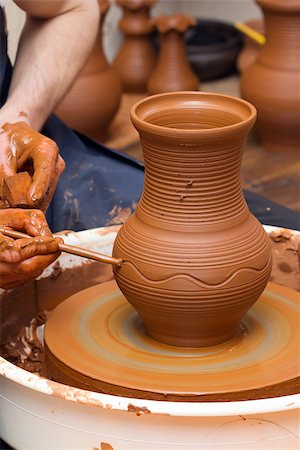 Close-up of hands making pottery on a wheel Stock Photo - Budget Royalty-Free & Subscription, Code: 400-06791626