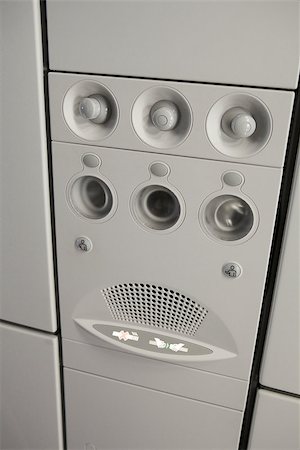 Upper deck on the plane where air conditioner, lamp, warning sign and speaker placed together Stock Photo - Budget Royalty-Free & Subscription, Code: 400-06793015