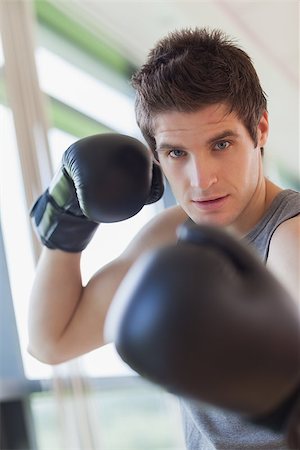 simsearch:400-03984387,k - Man is boxing at the gym Stock Photo - Budget Royalty-Free & Subscription, Code: 400-06801496