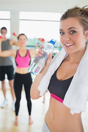 Woman with water and towel in aerobics class Stock Photo - Budget Royalty-Free & Subscription, Code: 400-06801547