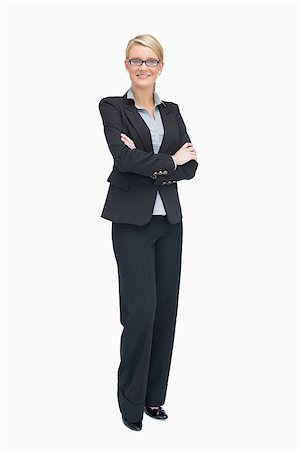 executive standing white background - Businesswoman standing with folded arms while smiling Photographie de stock - Aubaine LD & Abonnement, Code: 400-06802271