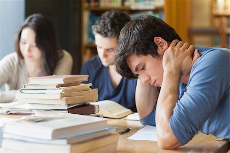 Student falling asleep at desk in college library Stock Photo - Budget Royalty-Free & Subscription, Code: 400-06802968